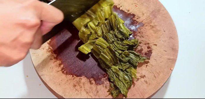 Cut the pickled cabbage into small pieces to help it absorb the spices.