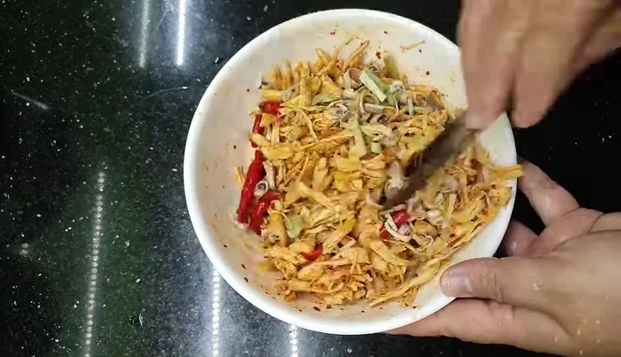 Stir-fry the marinated chicken until it begins to dry out (approximately 80 minutes total drying time).