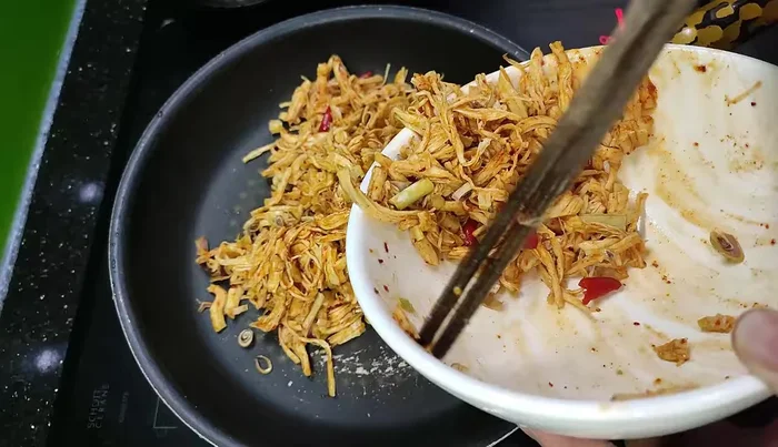 Transfer the chicken to an oven or air fryer to continue drying (approximately 20 minutes in the oven at 130 degrees).
