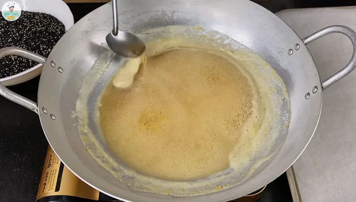 Test the sugar syrup by dropping a small amount into a bowl of cold water. It should solidify and not spread when removed. This indicates the correct consistency.
