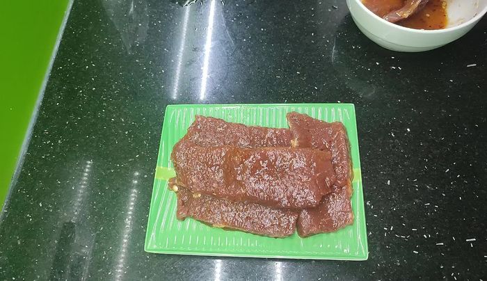 Grill the marinated beef.