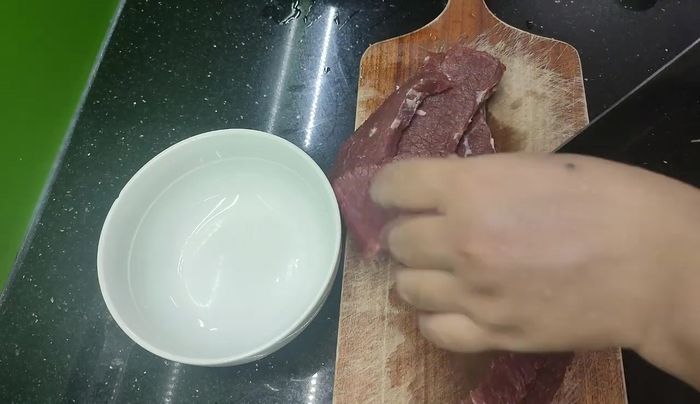 Pound the beef with a meat hammer until it's soft.