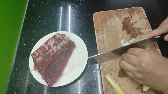 Wash and drain the beef ear.