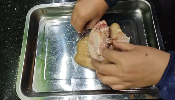 Roll the ear inside out, then roll the tongue inside the ear to ensure the spices soak in.