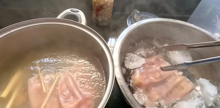 After boiling, immediately plunge pig's hands into ice water to maintain whiteness and crispness.