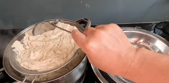 Drain the boiled tofu again in a basket.