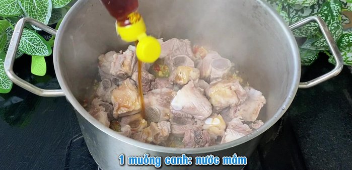 Add spare ribs, fish sauce, seasoning powder, and rock sugar to the pot. Stir-fry until spices are absorbed.