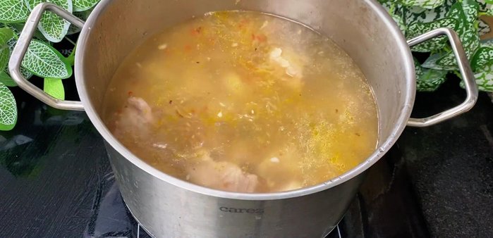 Add water (3-4 liters), onions, pineapple, and tomatoes. Simmer for 20-25 minutes on low heat until ribs are tender and broth is clear.