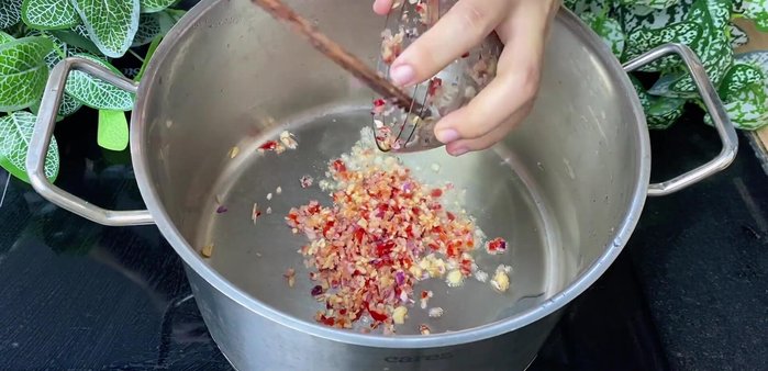 Stir-fry the blended mixture until fragrant and golden brown.