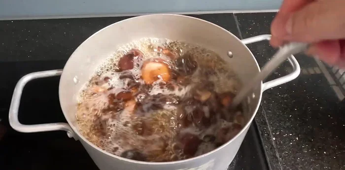 Remove from heat and let cool slightly. Strain the mixture through a strainer to remove mushroom pieces and radish solids.