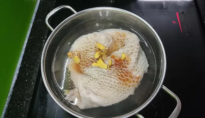 Boil until the bad smell is gone.