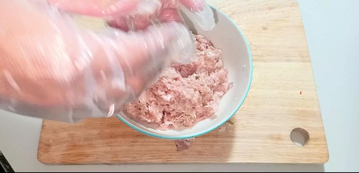 Shape the meatballs: Form the marinated pork mixture into small balls. 