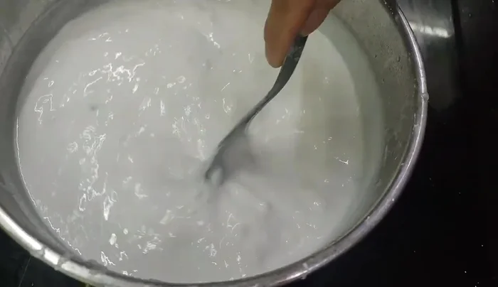 Wrap the Banh Te filling with a layer of the batter.