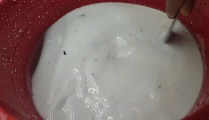 Drain the water and wash the rice thoroughly.
