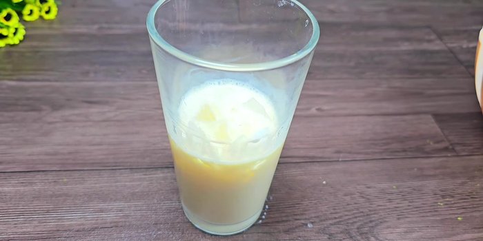 Add ice to a glass.
