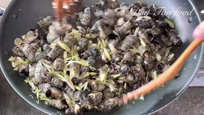 Add coconut milk and stir well. Increase heat slightly and continue stir-frying for 2-3 minutes.