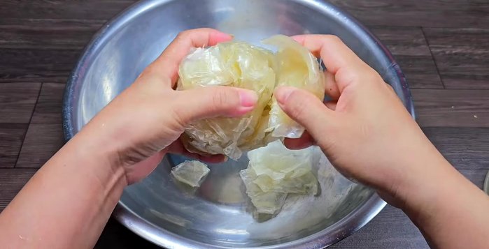 Assemble the salad: In a large bowl, combine the soft rice paper, sauce, fried shallots, roasted peanuts, beef jerky, and scallion oil. Gently mix.