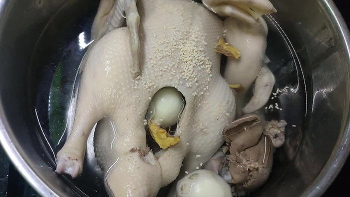 Boil the duck in hot water with additional wine or ginger to further clean it.