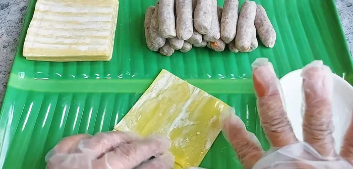 Wrap the spring rolls: Wet the edges of a wonton wrapper with water. Place the prepared filling in the center, fold the sides inward, and roll tightly. Seal the top edge by wetting it with water.