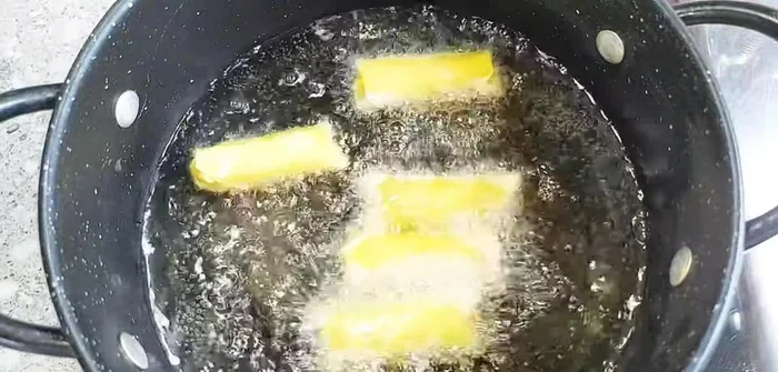 Fry the spring rolls: Heat cooking oil in a pan. Fry the spring rolls until golden brown and crispy. For extra crispiness, you can fry them twice, allowing them to cool completely between frying sessions.