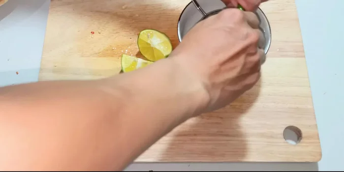 Squeeze out excess water from the marinated vegetables using your hands.