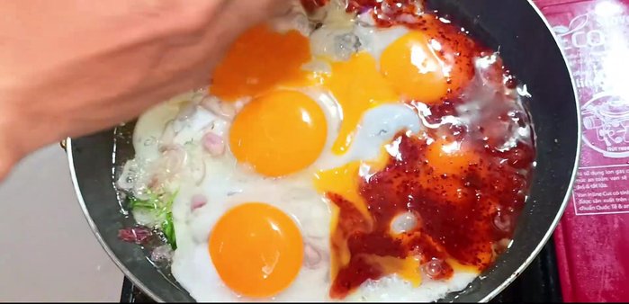 Pour the fish sauce mixture over the eggs. Let it simmer for about 30 seconds.
