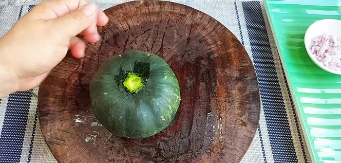 Cut the pumpkin to create a lid, then hollow out the inside. Use a slightly older pumpkin for a chewier texture.