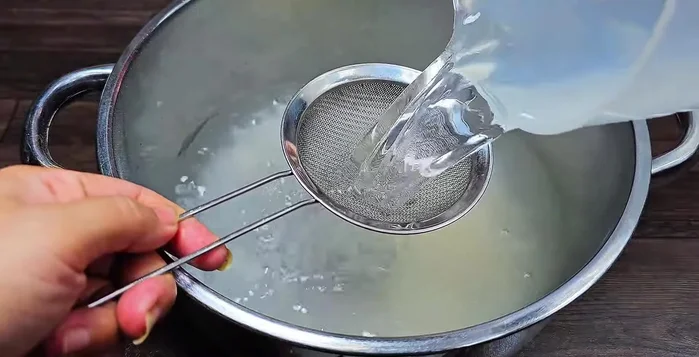 Add fresh coconut water, filtered through a sieve to remove residue. Adjust sugar amount based on coconut water sweetness.