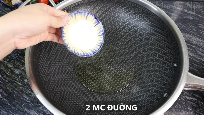 Caramelize the sugar: Heat 2 tablespoons of cooking oil in a pan. Add 2 tablespoons of sugar and cook until golden brown, stirring constantly to prevent burning.