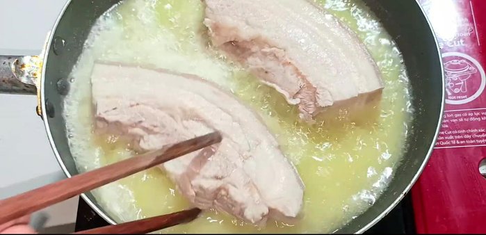 Fry the pork belly on medium heat, flipping occasionally, until golden brown and crispy. Fry in two batches for extra crispiness.