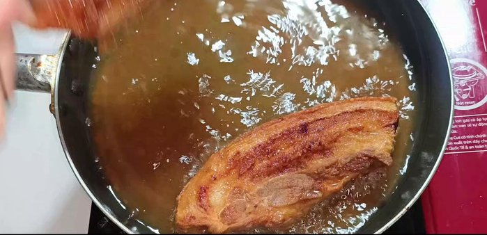 Drain the fried pork belly on a sieve to remove excess oil. Let it cool.