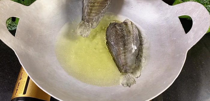 Fry the fish: Heat oil in a pan and fry the fish until golden brown and crispy.