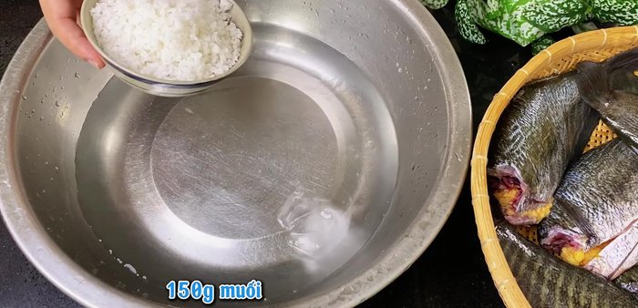 Marinate the fish: Mix water, ice, salt, MSG, chopped onion and garlic, pepper, and white wine.