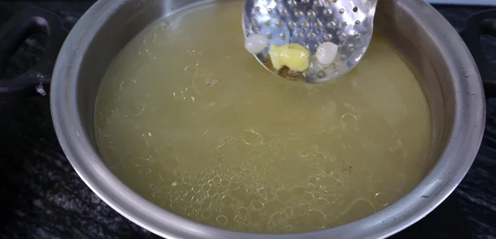 Combine roasted rice with duck broth, ginger, and shallots. Simmer for 40 minutes until rice is cooked into porridge.