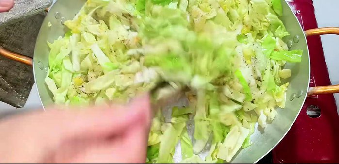 Increase heat to medium, stir-fry for about 1 minute until cabbage is slightly soft.