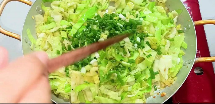 Add green onions and stir-fry for another 30 seconds.