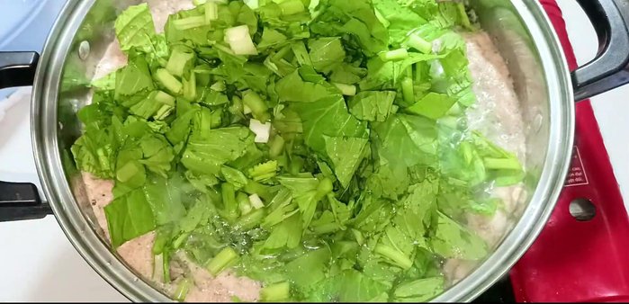 Add the cabbage, stir to ensure it's submerged in the boiling water.
