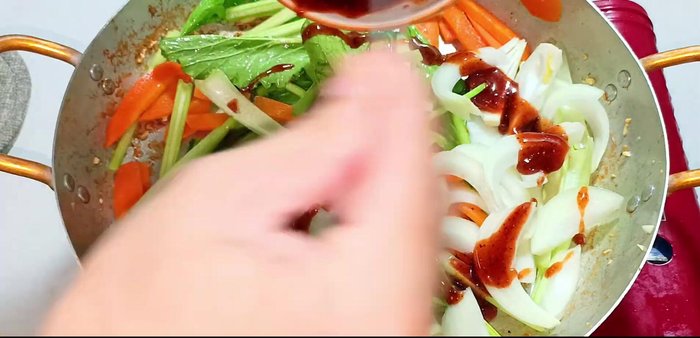 Add onions and the remaining sauce. Stir-fry until the sauce evenly coats the vegetables.