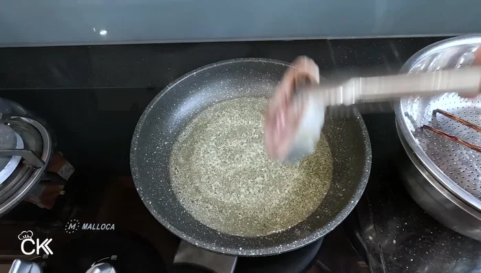 Fry the fish in hot oil until golden brown and firm on both sides. (247.439)