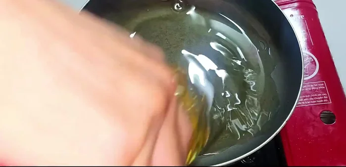 Heat cooking oil in a frying pan over medium heat.