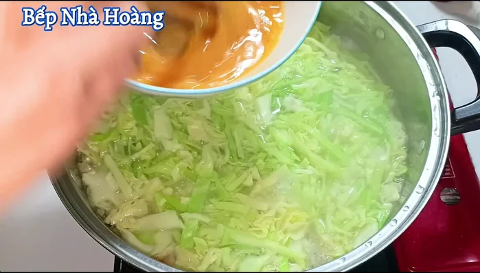 Once the broth boils again, add the beaten eggs, stir gently.