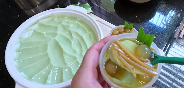 Once the tofu is set and the sugar water is cooled, serve the pandan tofu with the ginger tapioca pearls.