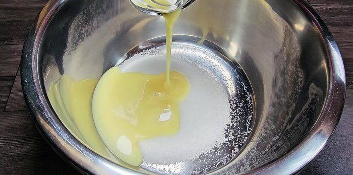 In a large bowl, combine sugar, 2 boxes of milk, and the blended cheese mixture.