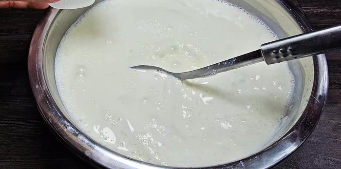 Add the 4 boxes of cooled yogurt and stir gently until incorporated. Ensure all tools are sterilized.