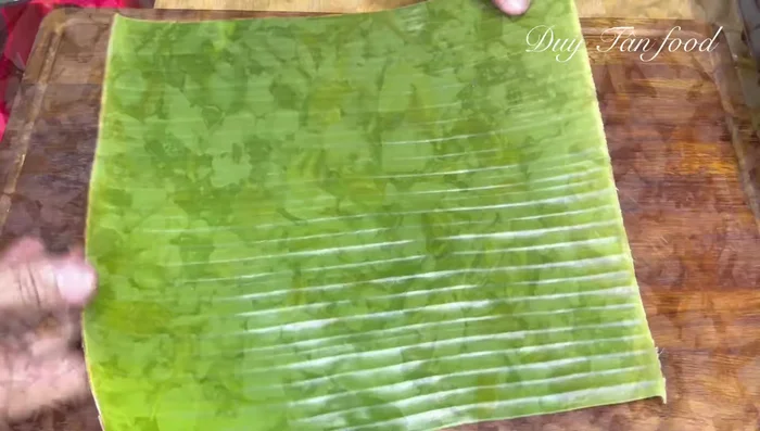 Prepare banana leaves: Blanch or dry banana leaves until pliable. For each Banh Gio, prepare one large and one small leaf.