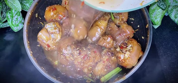 Add water (or coconut water) to cover the pork leg. Bring to a boil, then reduce heat to low. Simmer until the water reduces and the pork leg is soft and the color is beautiful.