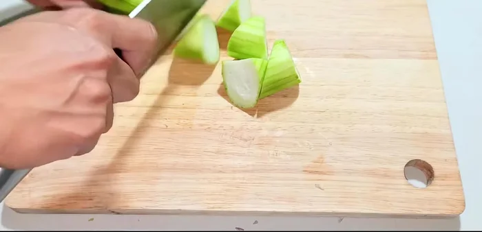 Cut the squash into bite-sized pieces. Cut the Malabar spinach into pieces – you don't need to cut them too small.