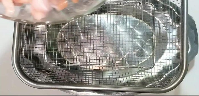Dry the marinated pork: Place the pork in a basket and let it dry in sunlight or near a heat source until dry.
