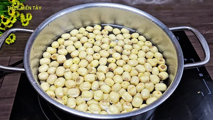 Boil the lotus seeds until soft. Check for softness by gently pressing a lotus seed with a spoon; they should be easily squished. Set aside the cooked lotus seeds and their water.