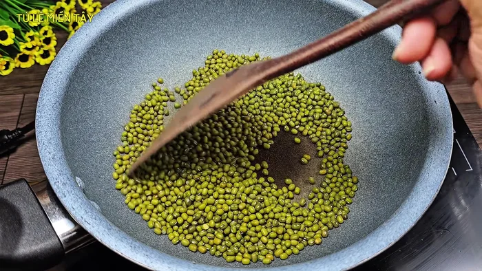 Roast the green beans in a pan over low heat until slightly warm to prevent splitting. This helps them soften quicker.